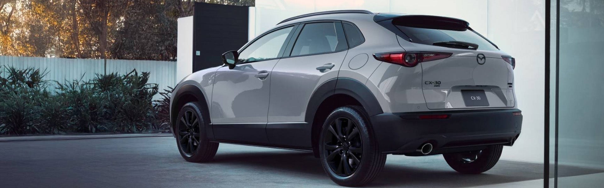White Mazda CX-30 SUV parked outdoors.
